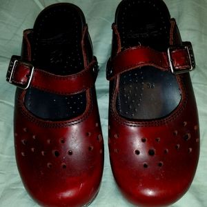 Red leather clogs